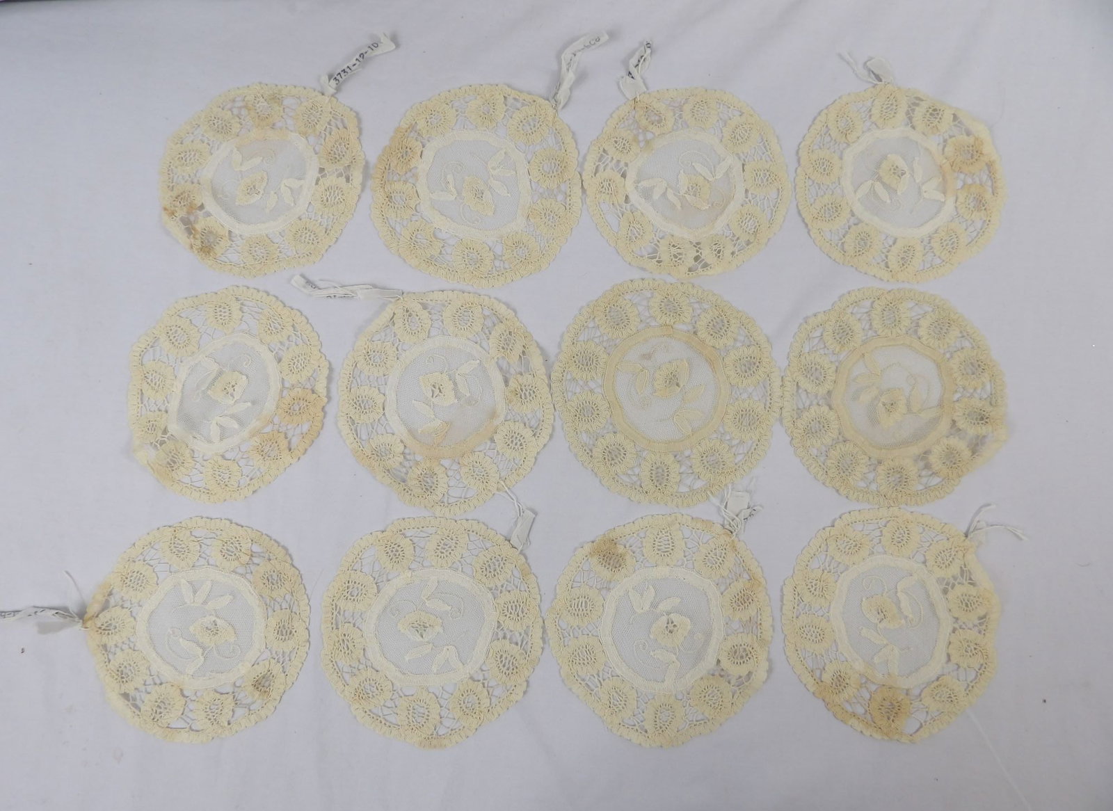 Set of 12 Vintage/Antique Lace Coaster/Doilies: approx. 5 3/4, see photo's, old store stock