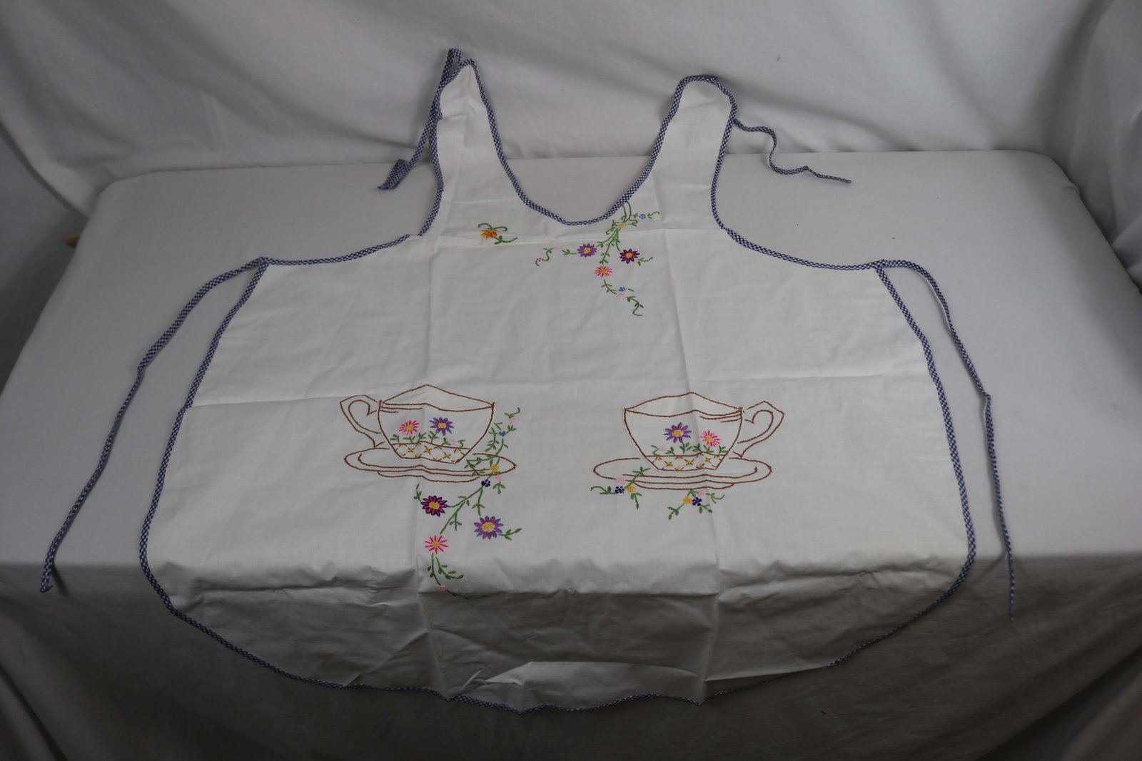 Vintage Old Store Stock Pinafore Apron with Embroidered Tea Cups: see photo's