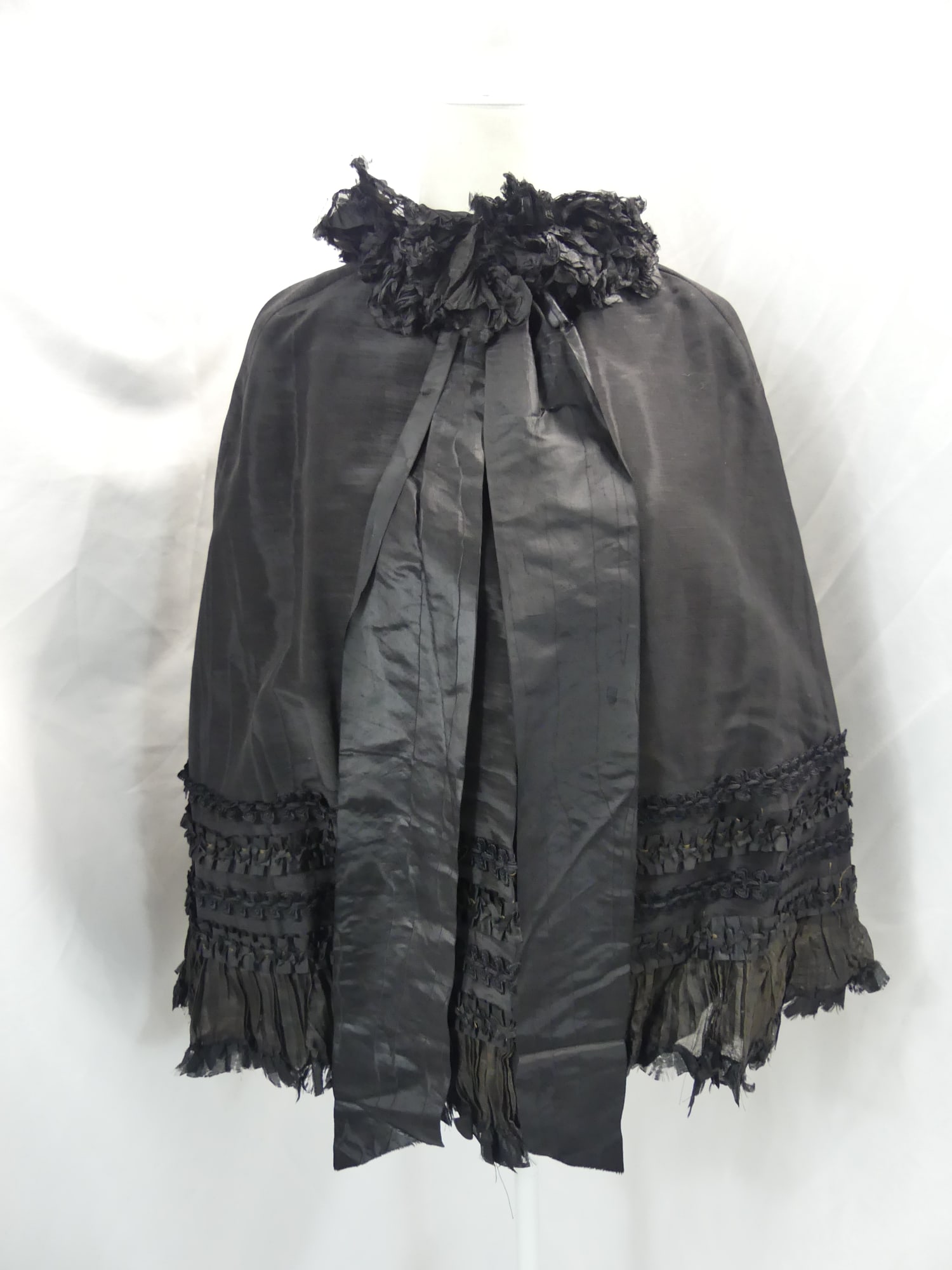 Antique 1800's Black Silk Cape with Applied Silk Trim: Has a spot on back that may come out with water, lining is frayed, see photo's