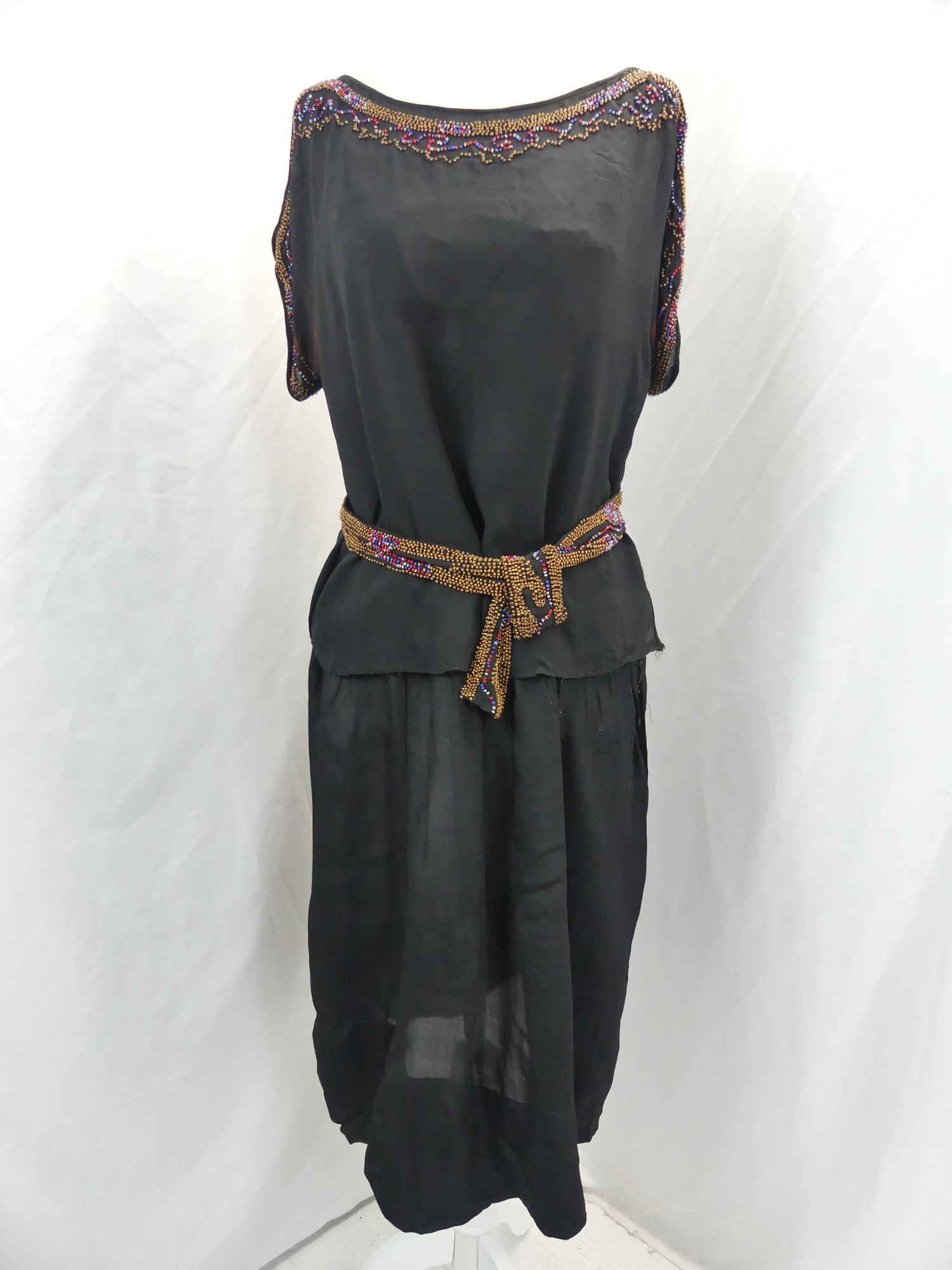 Vintage 1920's Black Silk Beaded Dress with Belt: approx. 40 bust, 38 waist. Skirt needs to be sown back on, has underarm staining, see photo's