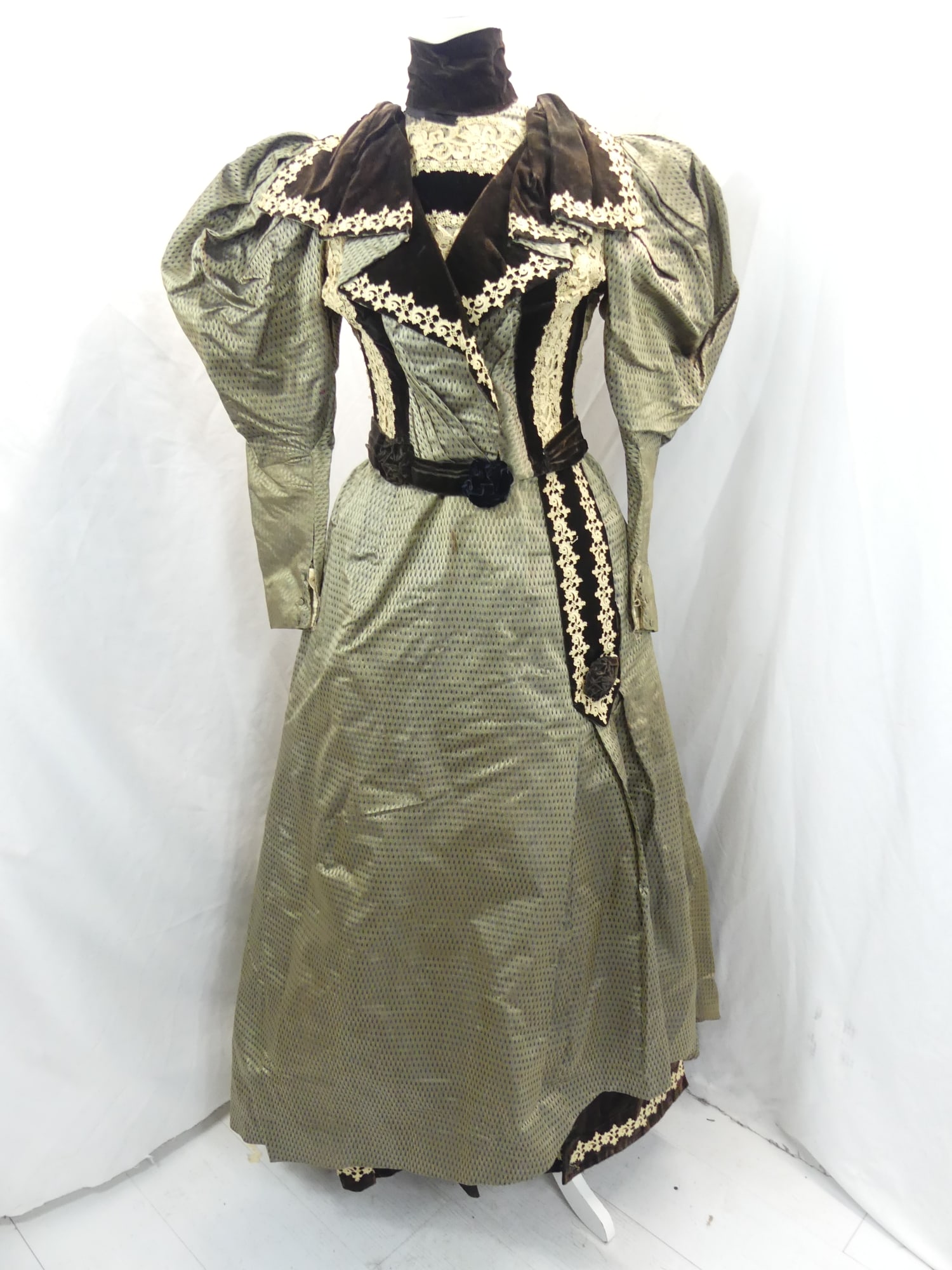 Antique 1800's Beautiful Minie Chapuis Green Silk with Black Velvet & Lace Bustle Skirt & Bodice: approx. 32 bust, 26 waist. Has some discoloration under arms, soil on inside of jacket & collar edging is frayed. The sleeve elbow is frayed. There is a stain on the skirt & needs seam repair at the w