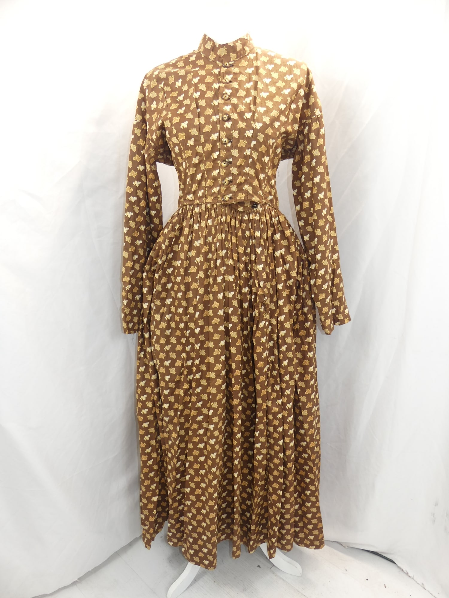 Antique 1860's Brown Leaf Print Cotton Prairie Dress: approx. 42 bust, 34 waist. Some discoloration under arms 7 looks like it has been adjusted under arms. Has a couple tiny holes under arms, see photo's