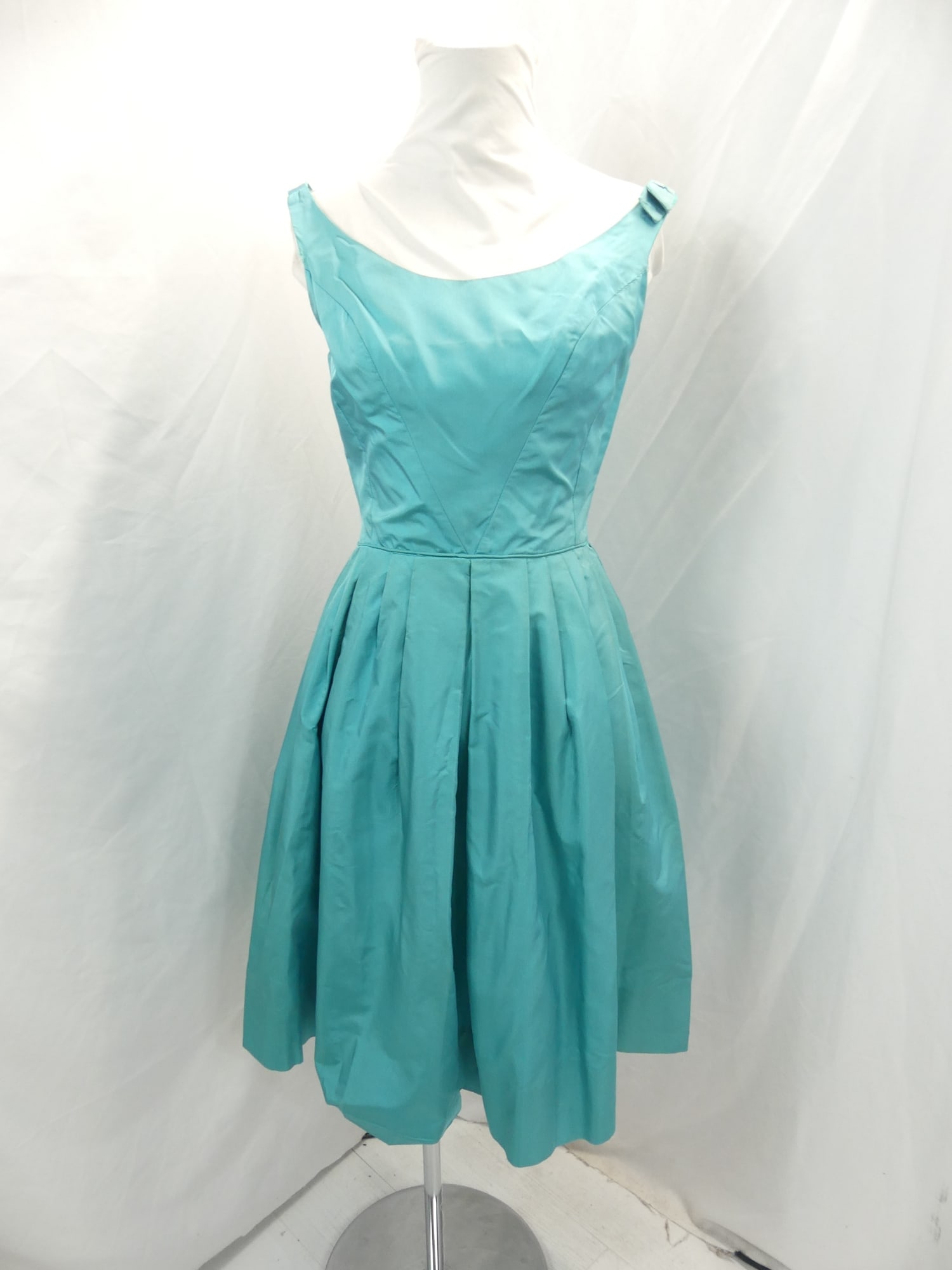Vintage 1950's Saks Fifth Avenue Teal Silk Box Pleated Party Dress: approx. 34 bust, 24 waist. Dress has been shortened & has old repairs by underarms. Has a missing the bow with other bow frayed at edges & looks as though the zipper has been taken out, see photo's