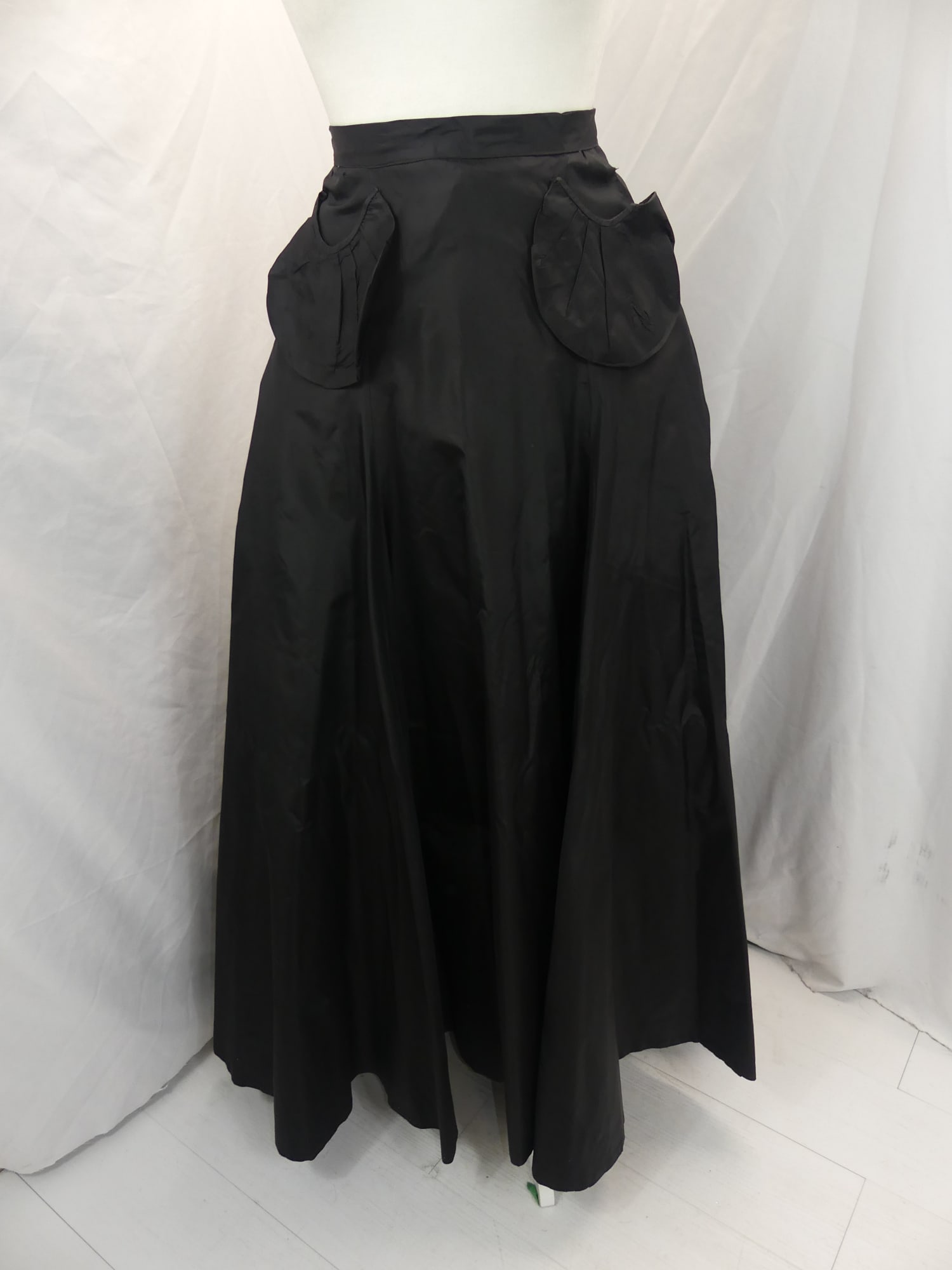 Vintage 1930's Black Silk Flared Full Length Skirt with Applied Pockets: approx. 28 waist. Some small holes at hem & couple of small holes by waistband, see photo's