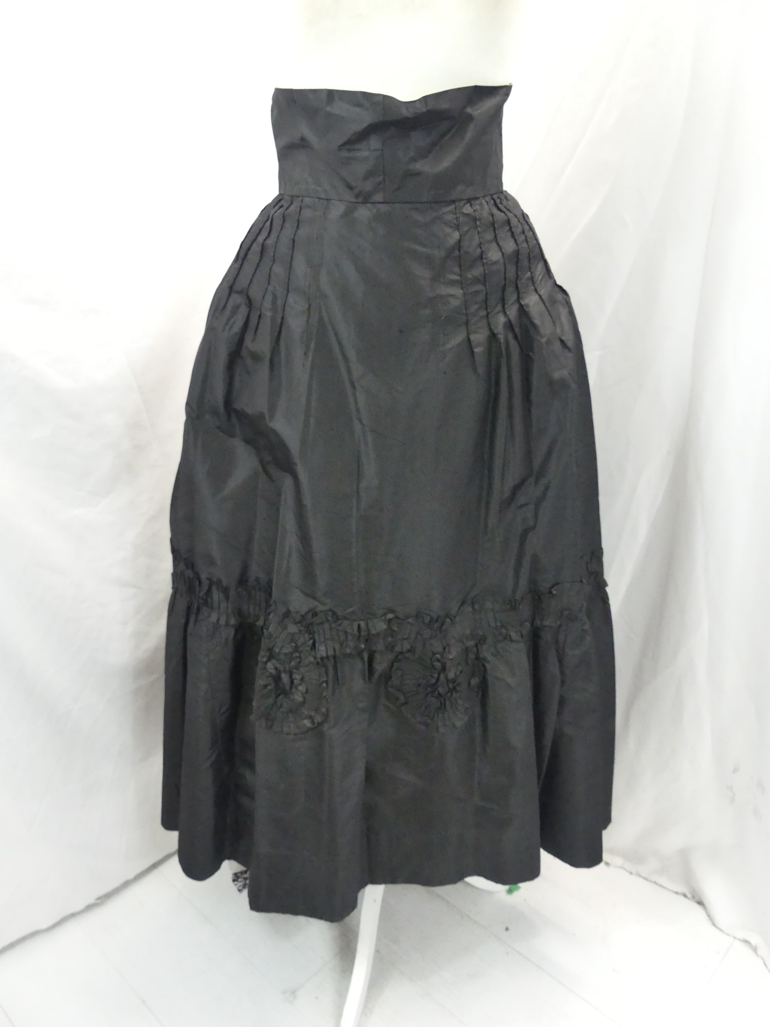 Vintage Early 1900's Black Silk Skirt with Ruffled & Rosette Trim: approx. 28 waist. Has a couple of pin holes seen when held up to the light, see photo's