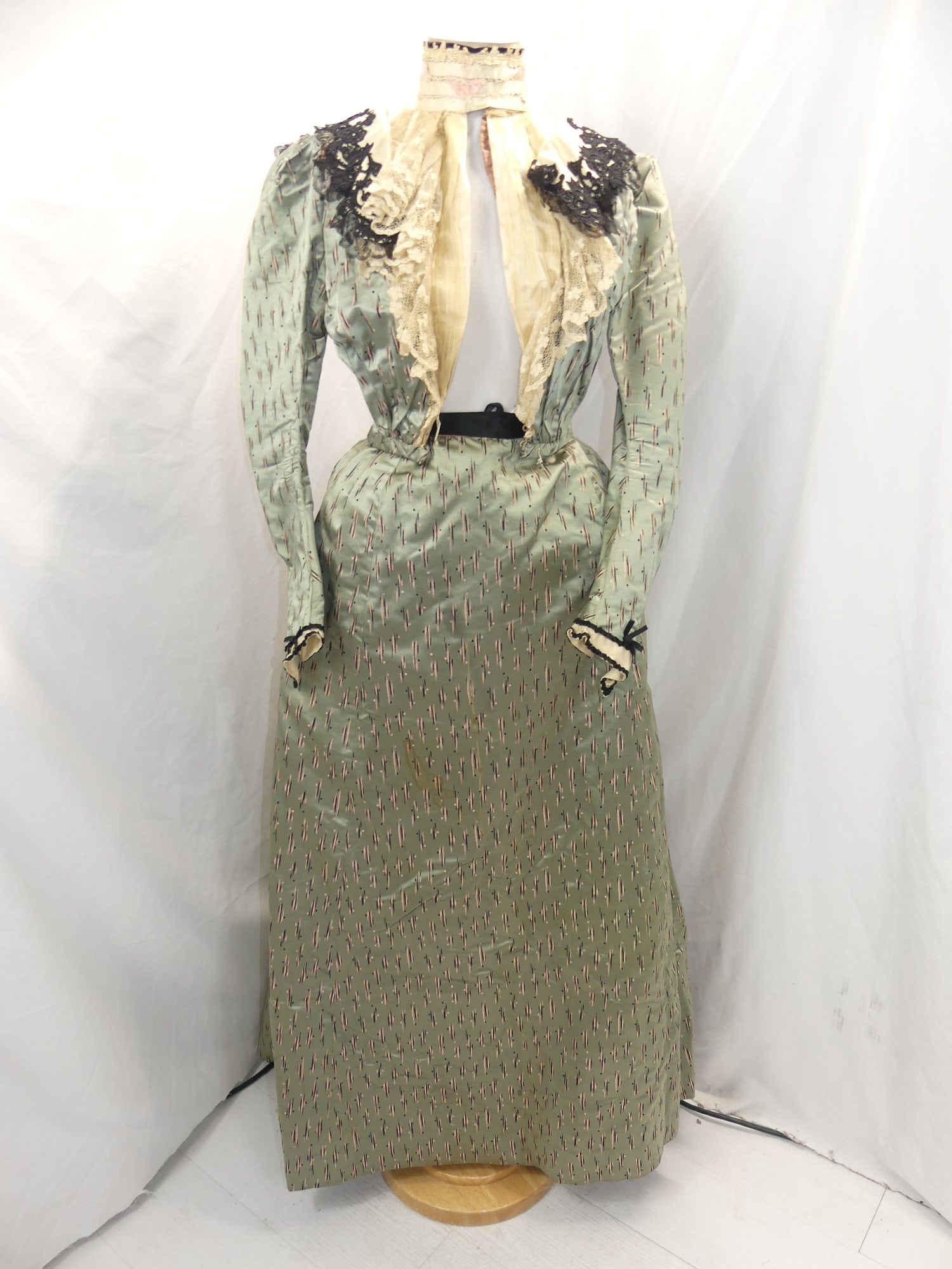 Antique 1800's Green Silk with Peach & Black Bustle Skirt & Bodice Trimmed in Lace: approx. 30 bust, 22 waist. Some fray at top of the yoke that could be removed without damaging the bodice. Needs some seam repair at the waist of the skirt & has some soil at the hem otherwise good co