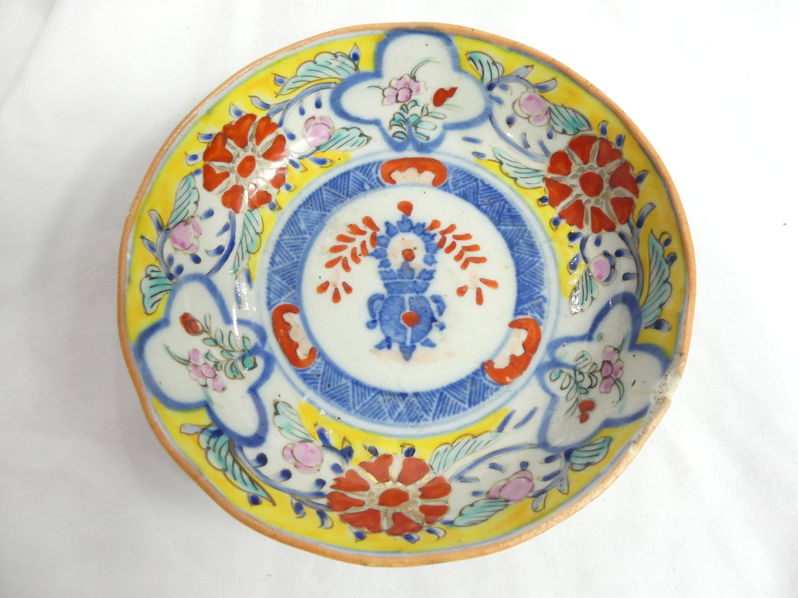 Antique Chinese Hand Painted Porcelain Bowl with Flowers: approx. 6 inches, chip on rim, see photo's