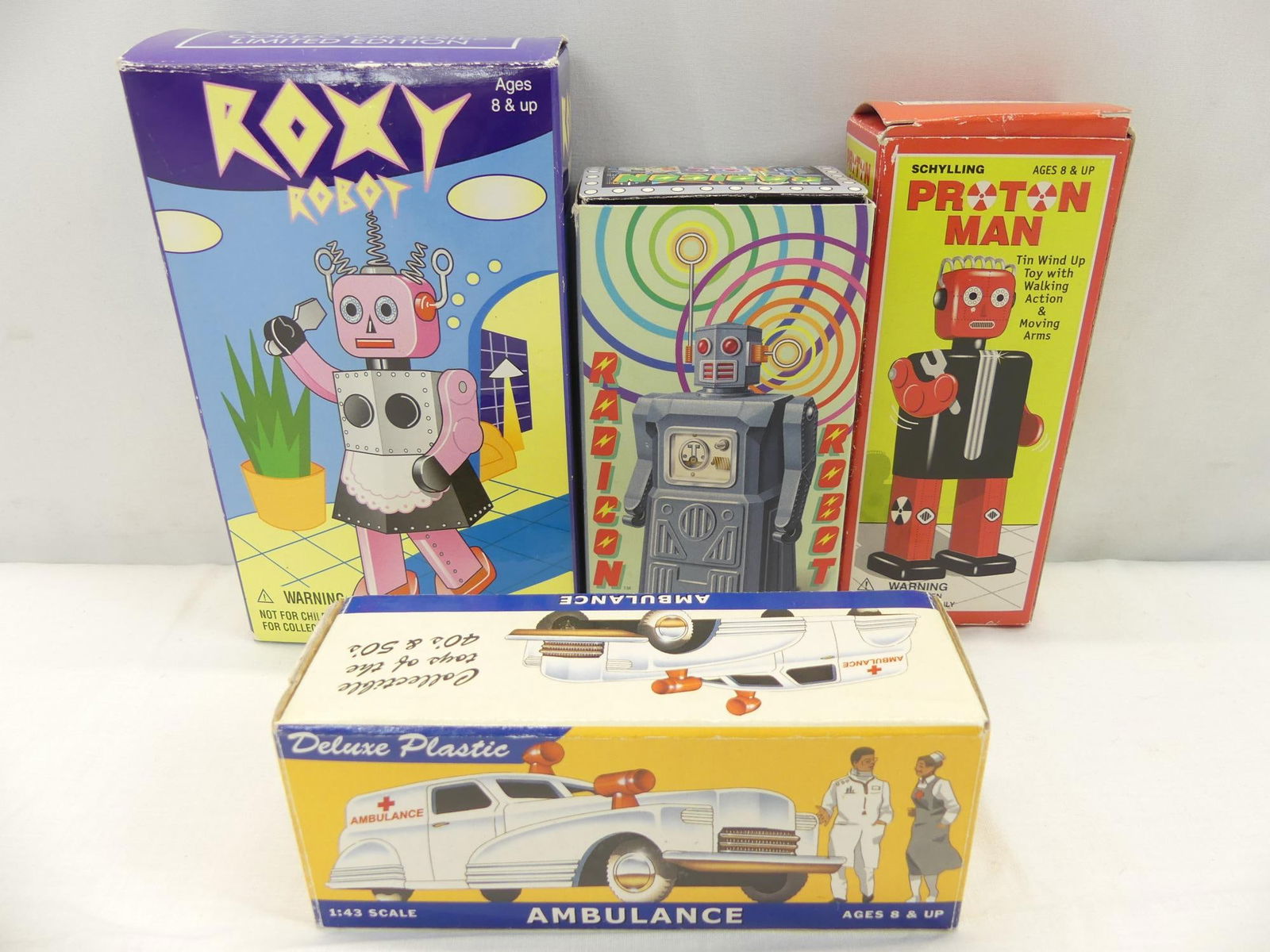 Lot of 4 Vintage Reproduction Tin Toys: with original boxes, see photo's