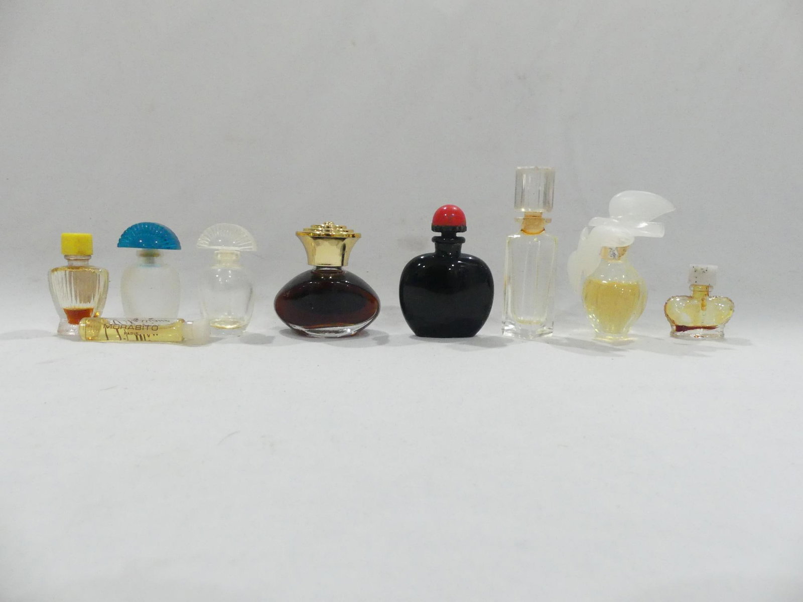 Lot of 9 Vintage Perfume bottles, some with Perfume: see photo's
