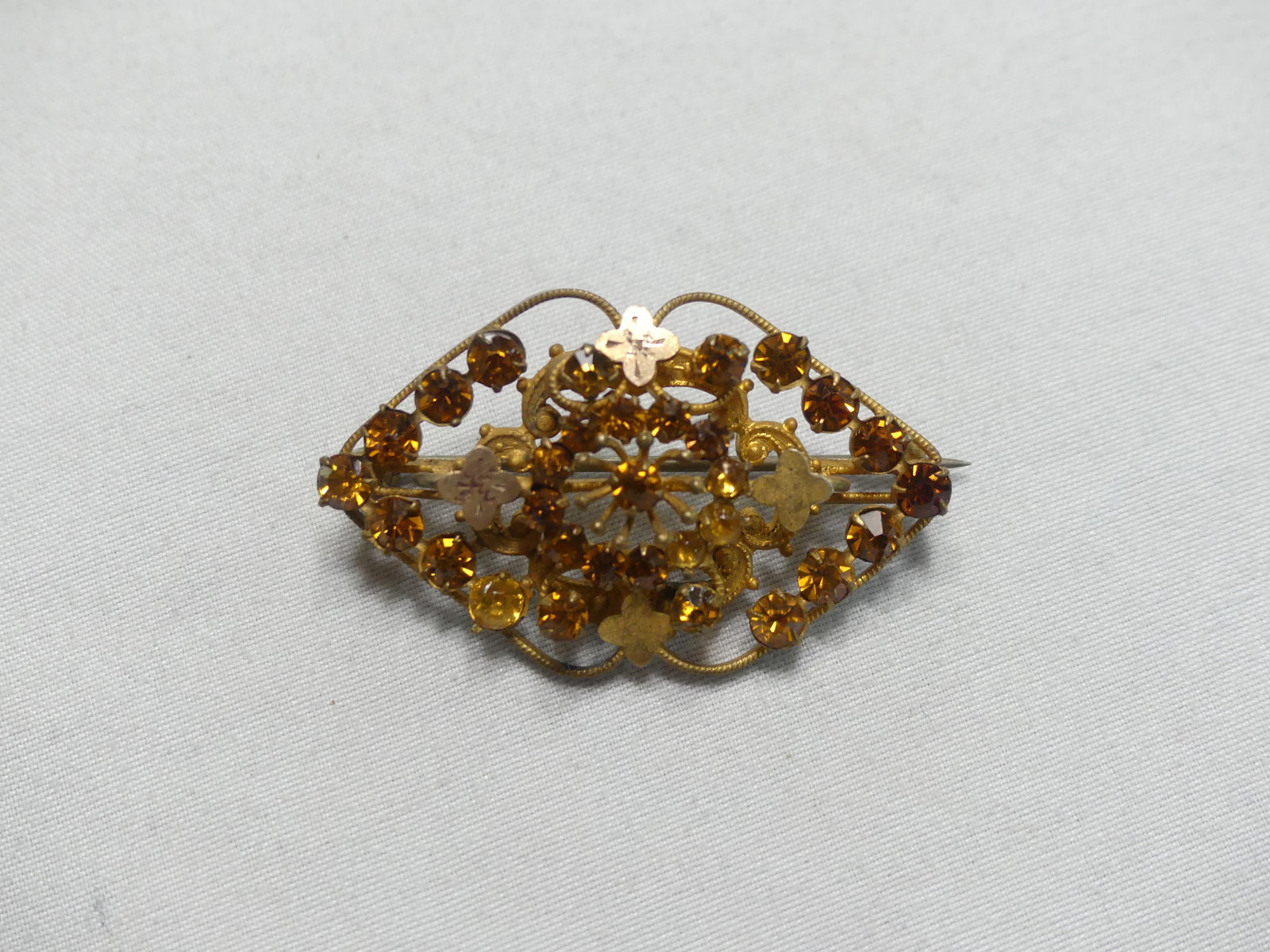 Antique Paste Brooch: Gold tone with amber rhinestones, approx. 1.5" x 1''