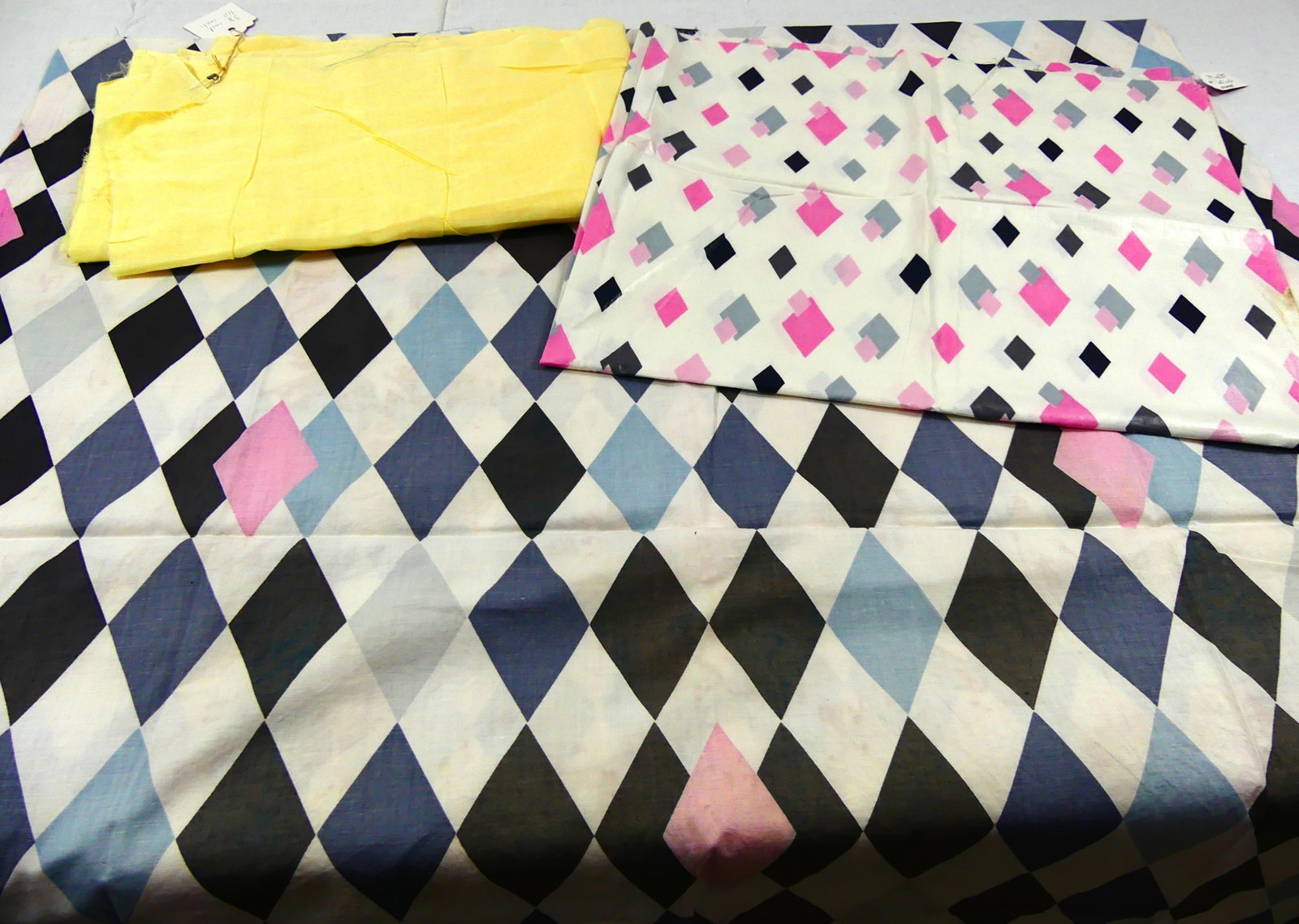 THREE VINTAGE MID CENTURY PRINTED & PLAIN COTTON YARDAGE: harlequin approx. 36" x 69", yellow 38" x 110", diamond 30" x 35", light stains, see photos
