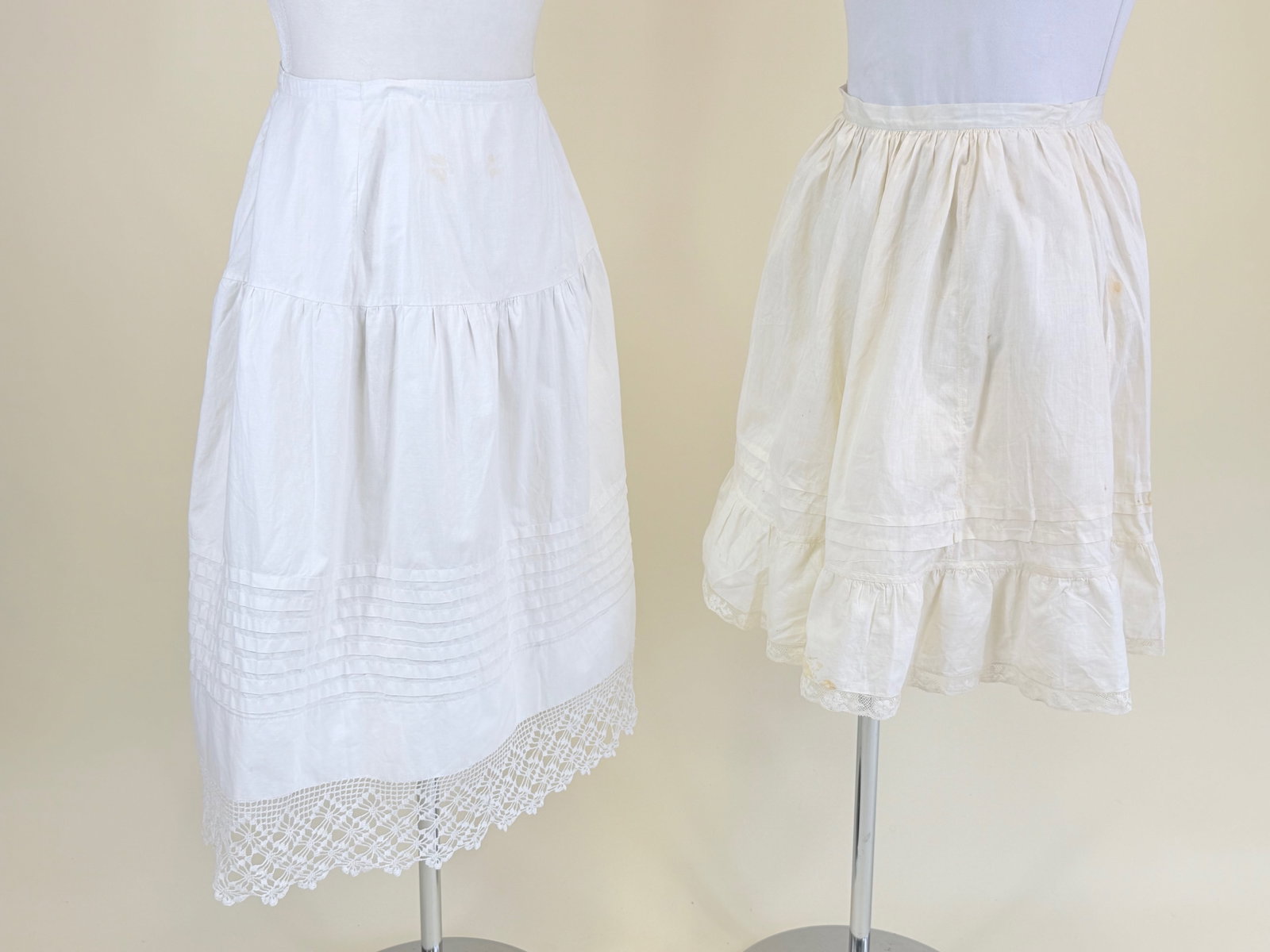 TWO ANTIQUE GIRL'S PETTICOATS: One W 21", one W 22", some spot stains, see photos