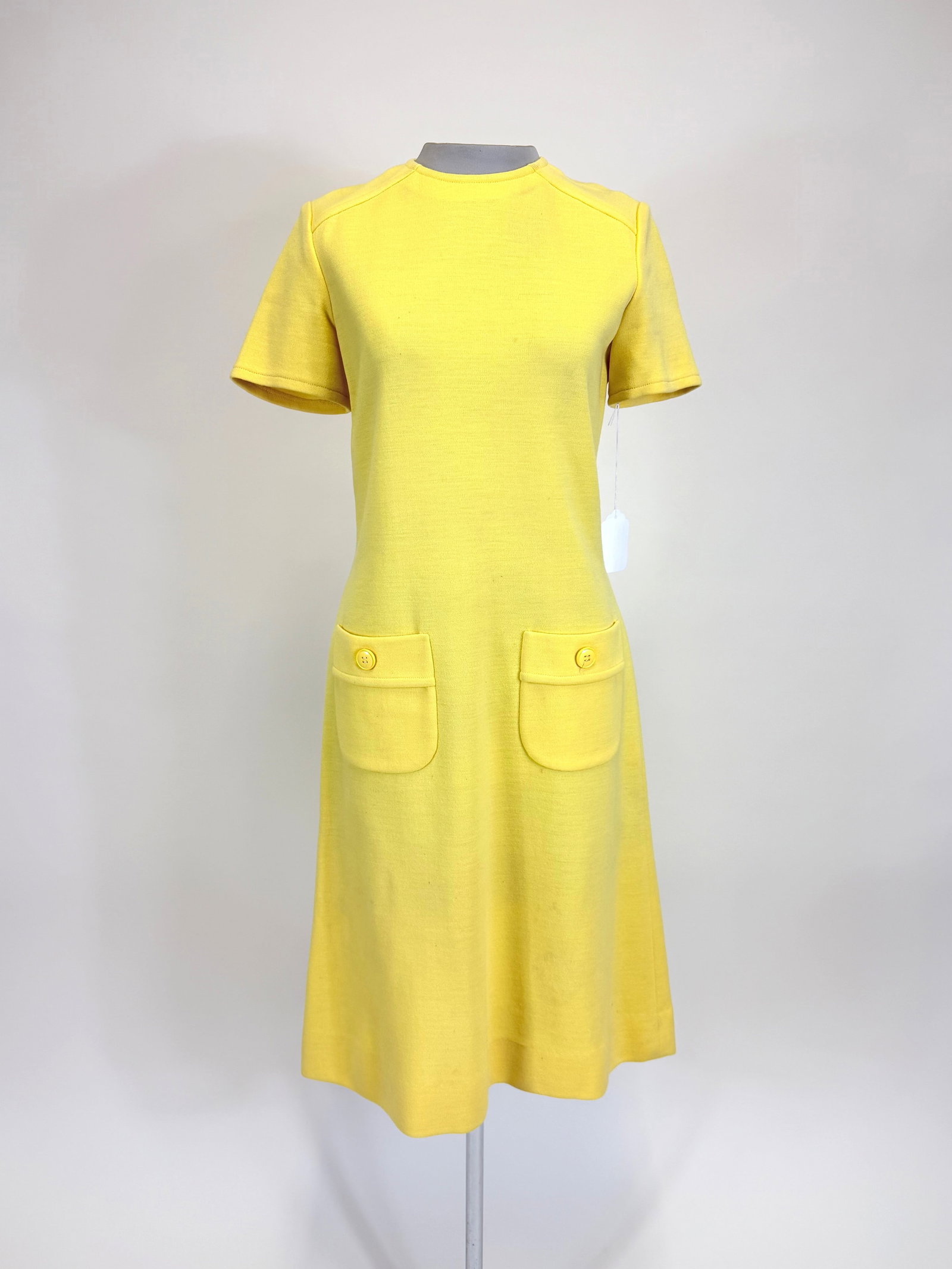CANARY YELLOW WOOL DAY DRESS, 1966: B 37", W 30", discoloration, small spot stains, see photos. Provenance: From the M. Estella Sprague Costume Collection