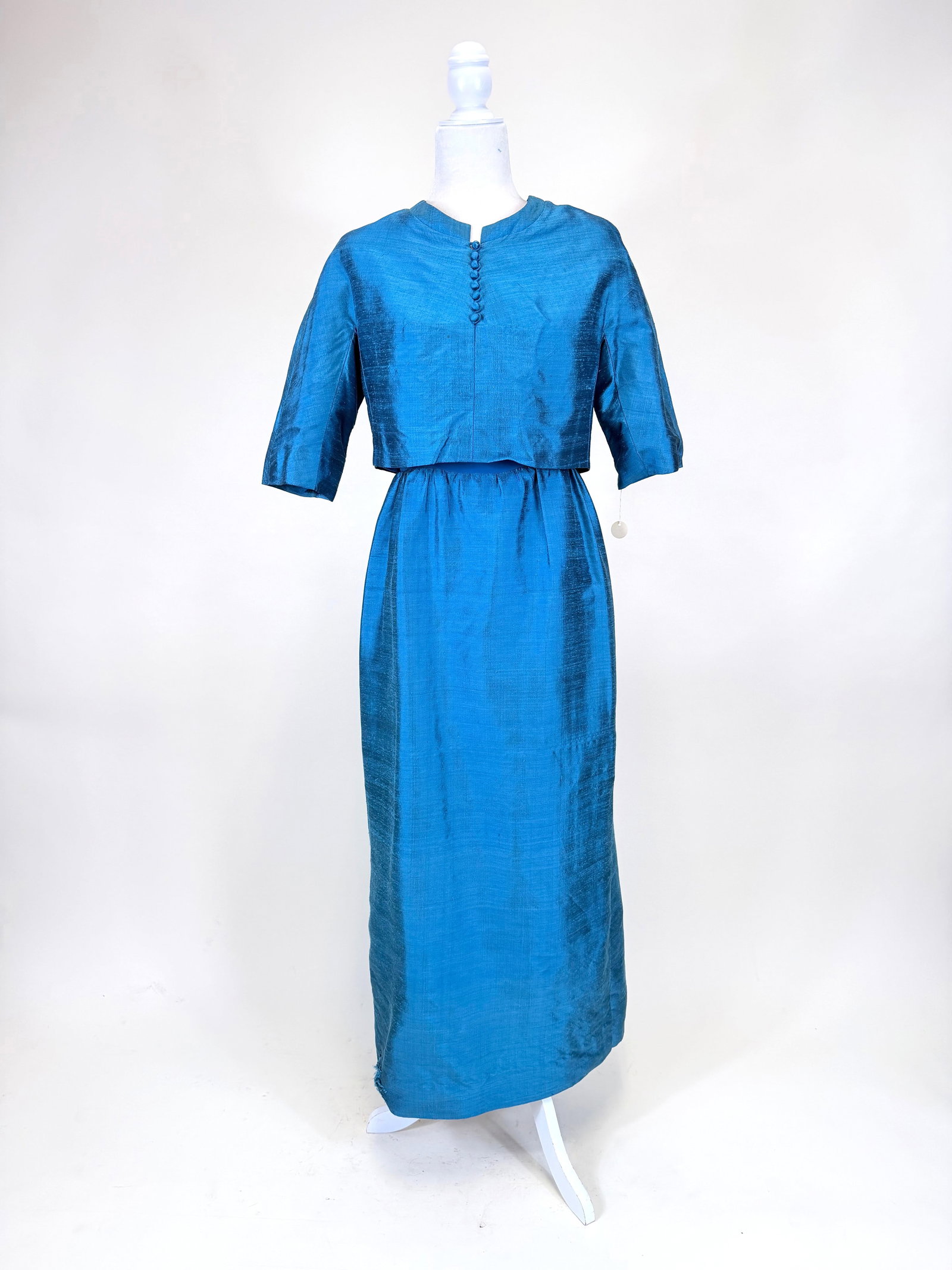 BLUE SILK SHANTUNG TWO PIECE EVENING ENSEMBLE, c. 1960: Jacket B 34", L 15", dress B 34", W 27", small spot stains, light pilling, see photos. Provenance: From the M. Estella Sprague Costume Collection