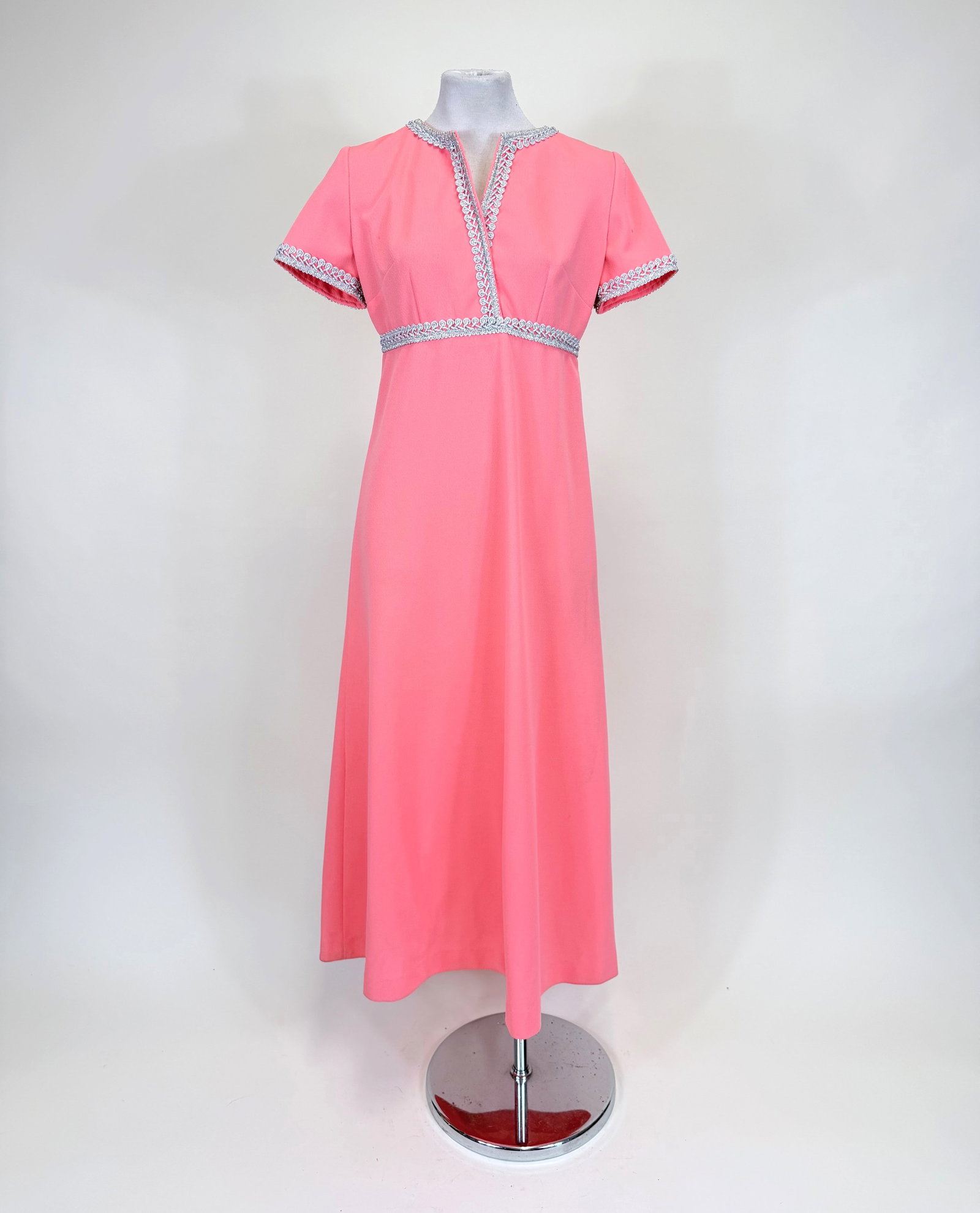 SILVER PASSEMENTERIE & SALMON CREPE EVENING DRESS, 1960s: B 36", W 29", light discoloration to skirt, spot stains to sleeves, see photos.