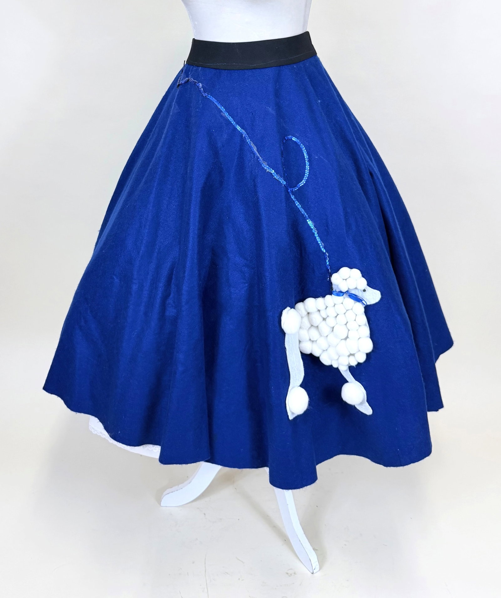 BLUE FELT 1950s STYLE POODLE SKIRT, 1980s-1990s: W 38", L 32", includes corded tie belt, loose costume construction, glue residue at sequins, see photos.
