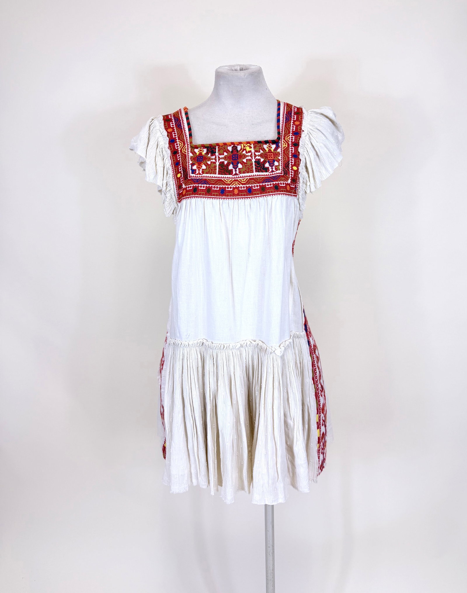 FREE PEOPLE REGIONAL EMBROIDERED MINI DRESS: B 37", W 37". Good condition.