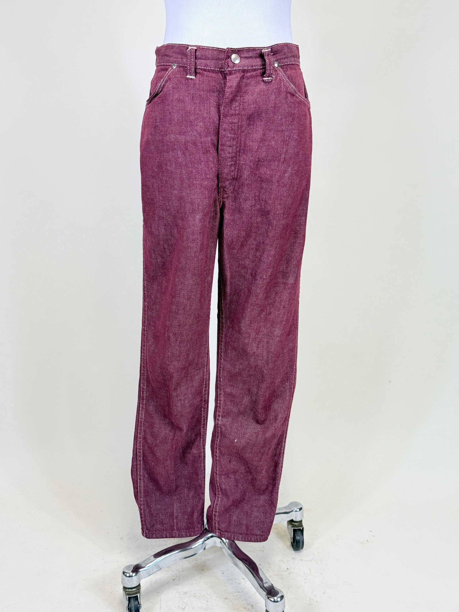PAIR OF BURGUNDY WRANGLER JEANS, 1960s: W 28", residue at seat, see photos