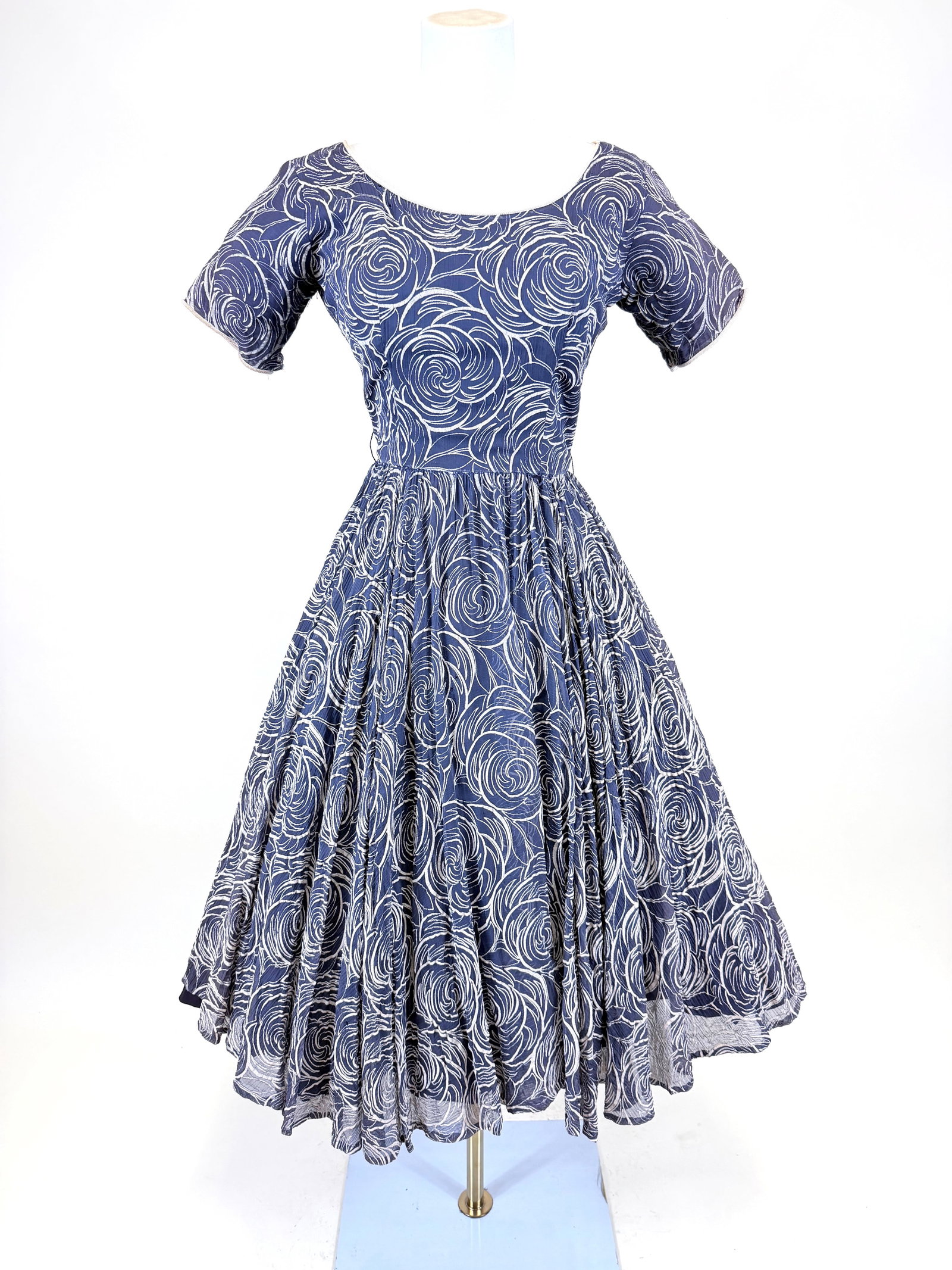 FLOCKED NAVY CREPE PARTY DRESS, 1950s: B 35", W 25", hole to one sleeve, small holes to waist, discoloration to corded binding, see photos