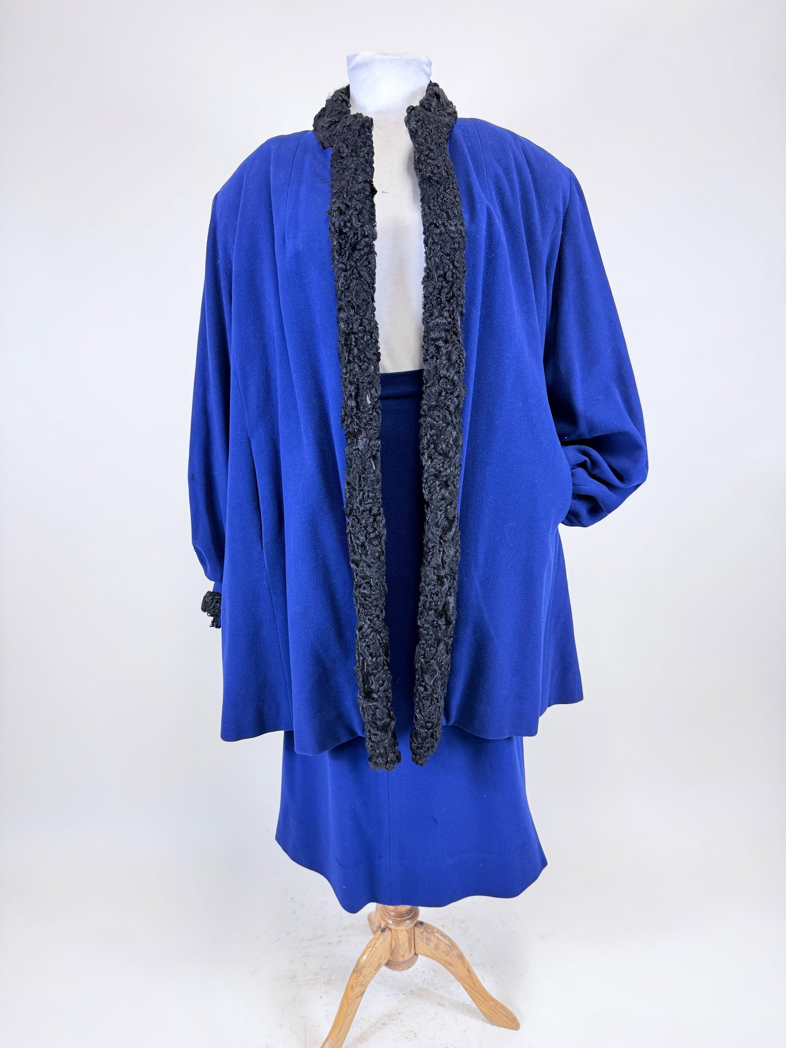 BLUE WOOL & ASTRAKHAN TWO PIECE ENSEMBLE, 1980s: Coat SH-SH 19", L 35", skirt W 25", separation between collar, wear to lambswool, see photos. Provenance: Middlebury Clothing Antique Collection, originally from Purdue University's Costume Collection