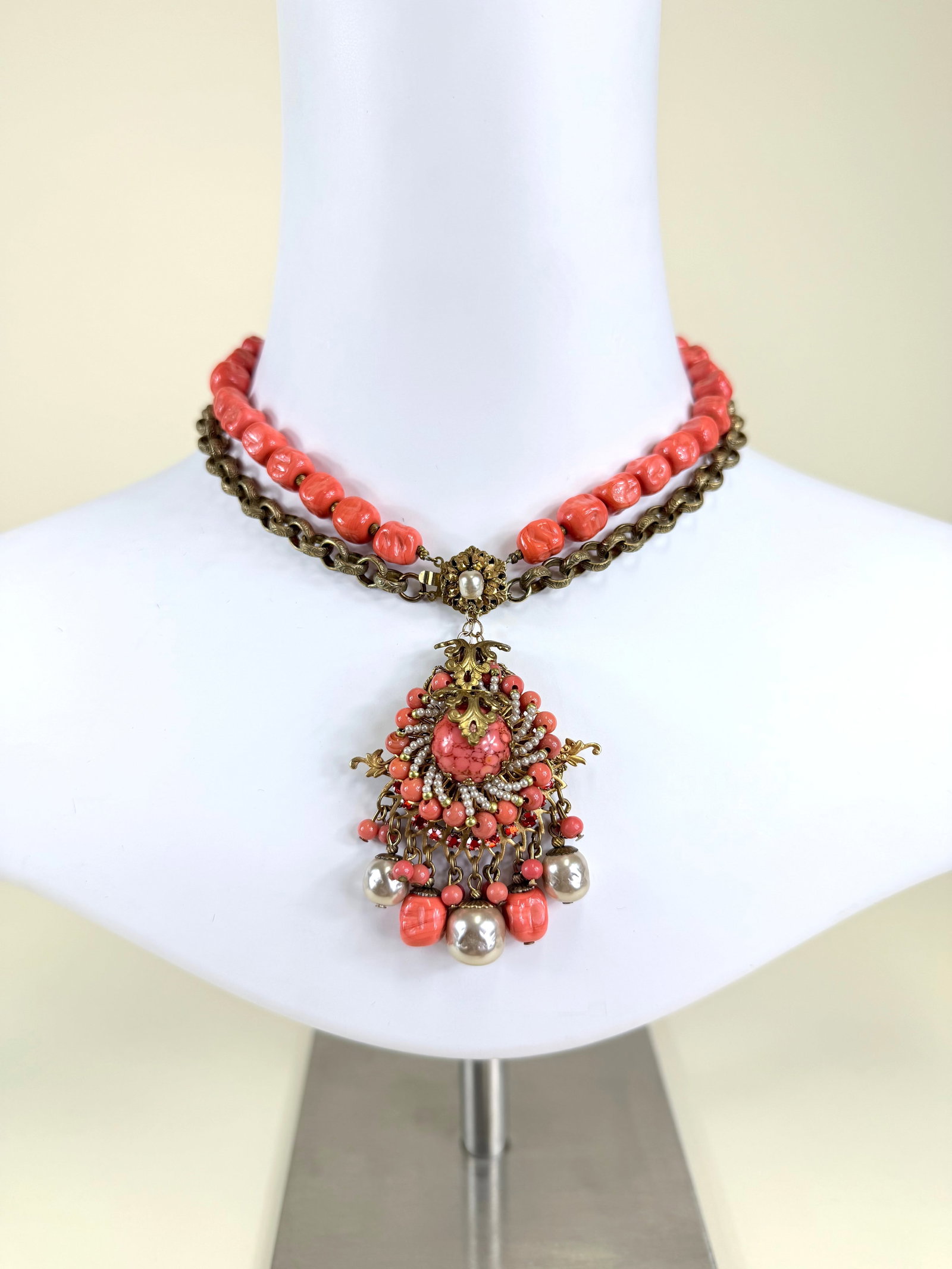 MIRIAM HASKELL CORAL BEAD NECKLACE, MID 20TH C: Necklace 15", pendant 2" x 2.5", light tarnish, some warping to clasp but functional & positive, see photos
