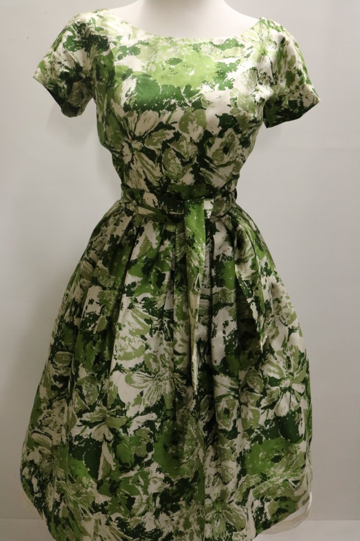 1950's Green Floral Cocktail Dress: green silk, short sleeves, ties at waist and pleated, back zipper, approx. 36/38 bust, 26 waist