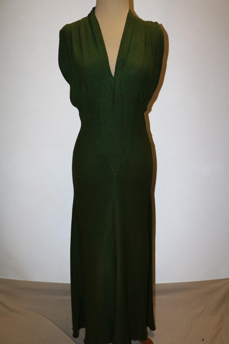 1930's Olive Green Arlean Andre' Creation: nicely fitted gown with plunging v neck gathered bodice, high neck in back with cut out panels, gathered cap sleeves high waist in front silhoutte fit, approx. 38 bust, 28 waist