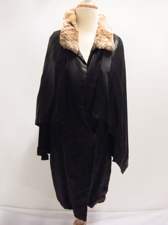 vintage 1920s black silk coat with cape bodice and: vintage 1920s flapper era coat with a unique caped body, attached, mink and fabric collar in points at back with ruffled fabric detail. Some splits to fur but coat in excellent condition.
