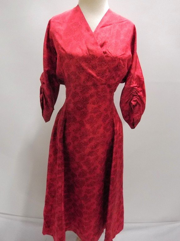 1940/50's Red Floral Dress with Criss-Cross Bodice: domain sleeves with gathering, back zipper, waist with darts, acetate fabric, approx. 44 bust, 34 waist