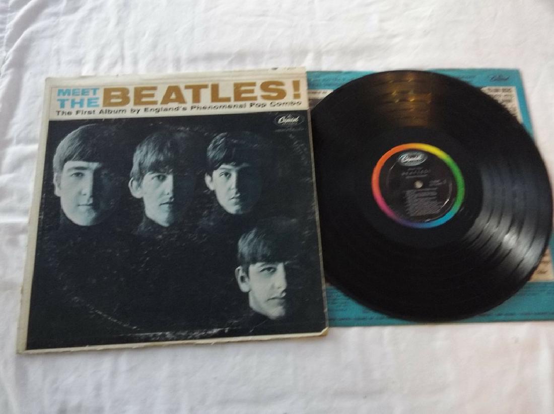 Meet The Beatles! The first album by England's: 33 1/3 rpm record album, some wear to cover, seam damage