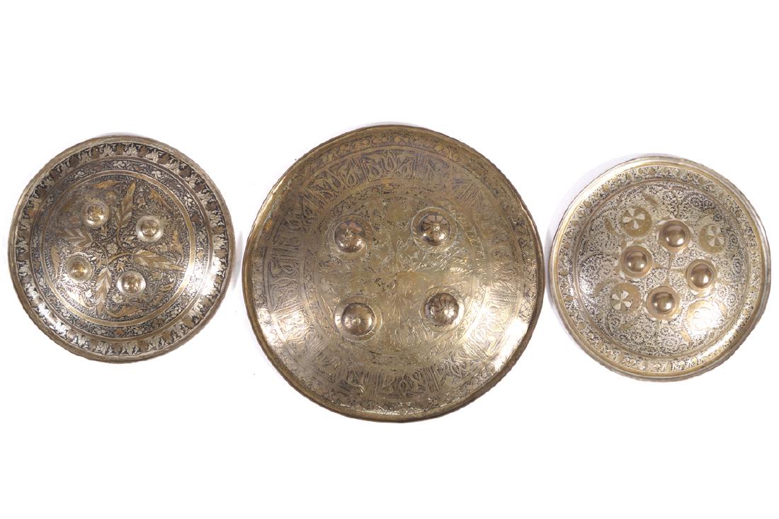 THREE NINETEENTH-CENTURY INDIAN ‘DHAL’ BRASS MOUNTED (1 of 1)