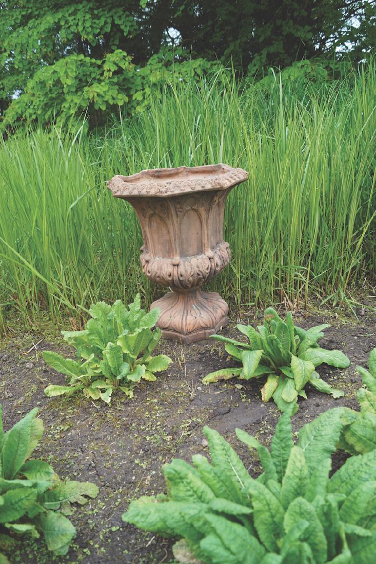PAIR OF TERRACOTTA JARDINIERES: each with Gothic panelled sides53 cm. high; 42 cm. diameter (2)