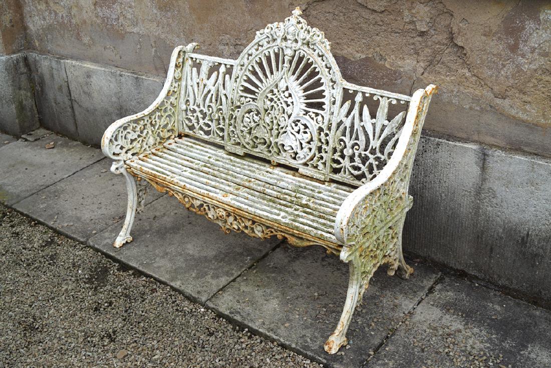 PAIR OF CAST IRON PIERCE OF WEXFORD GARDEN SEATS: PAIR OF CAST IRON PIERCE OF WEXFORD GARDEN SEATS Dimensions: 97 cm. high; 120 cm. wide