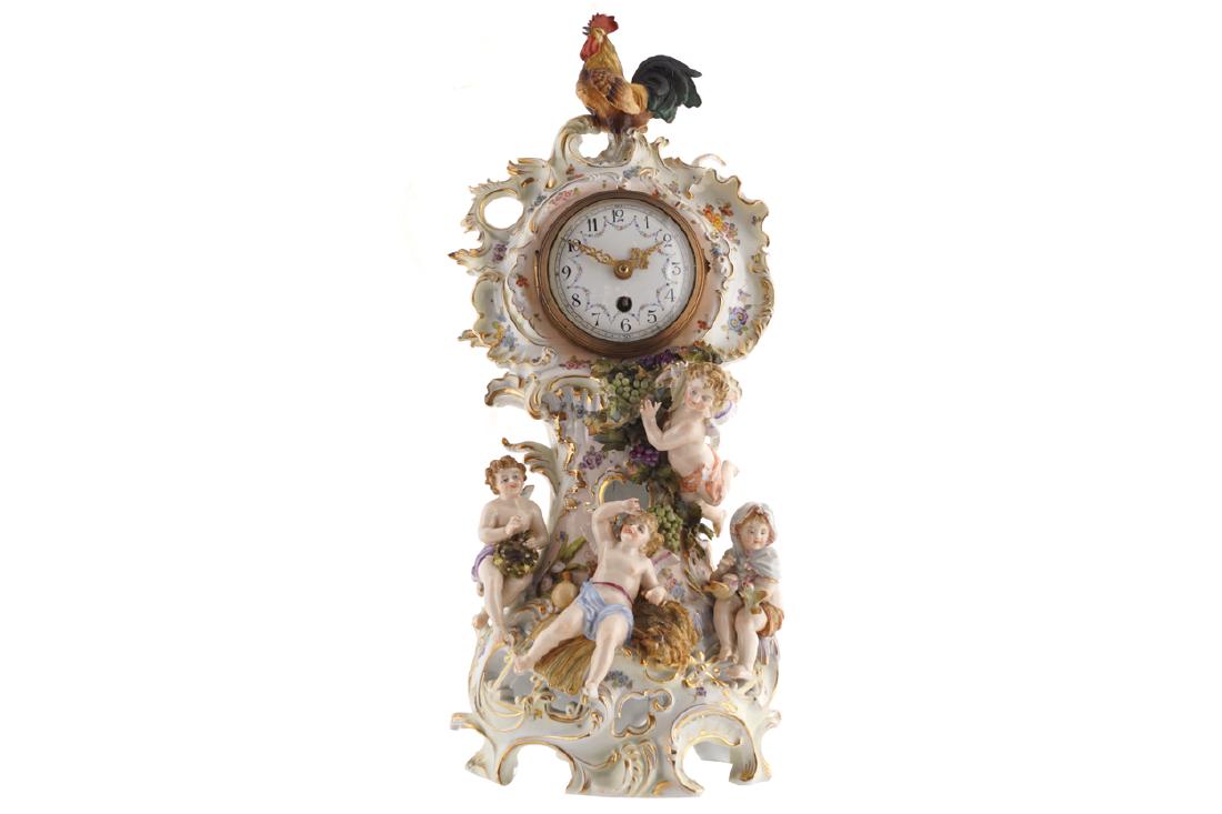 NINETEENTH-CENTURY GERMAN ROCOCO PORCELAIN BANJO SHAPED: mounted with cherubs and vines, surmounted by a cockerel Dimensions: 42 cm. high