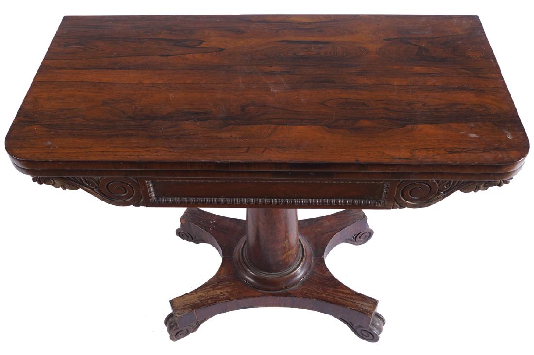 WILLIAM IV PERIOD ROSEWOOD CARD TABLE: WILLIAM IV PERIOD ROSEWOOD CARD TABLE the serpentine top above a bateau shaped frieze, raised on a turned stem and platform base Dimensions: 75 cm. high; 91 cm. wide; 46 cm. deep