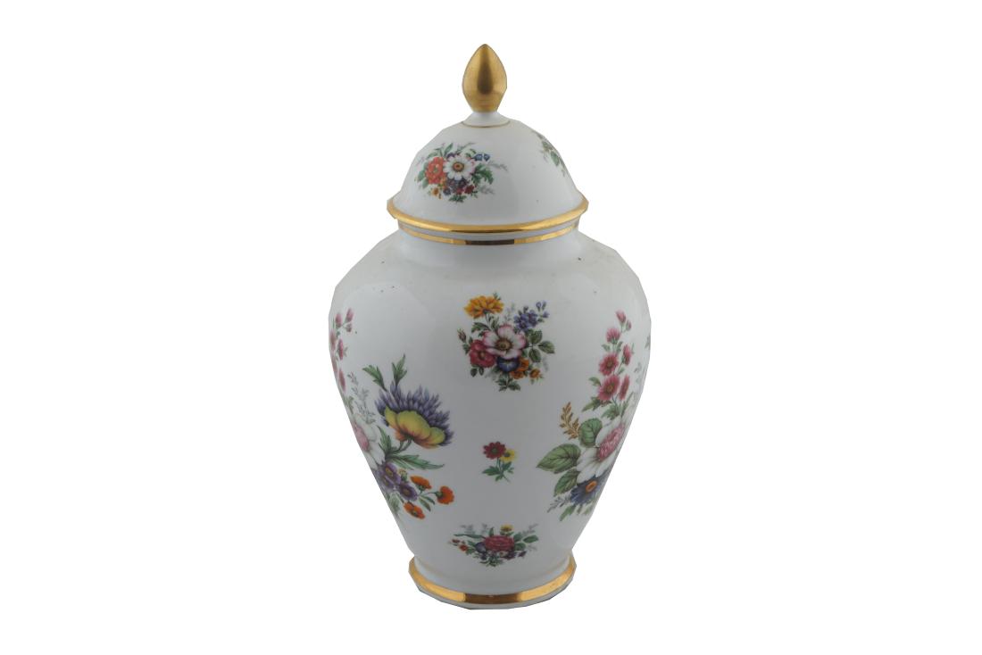 BAVARIAN PORCELAIN URN AND COVER: of ovoid form with floral decoration on a white ground 28 cm. high