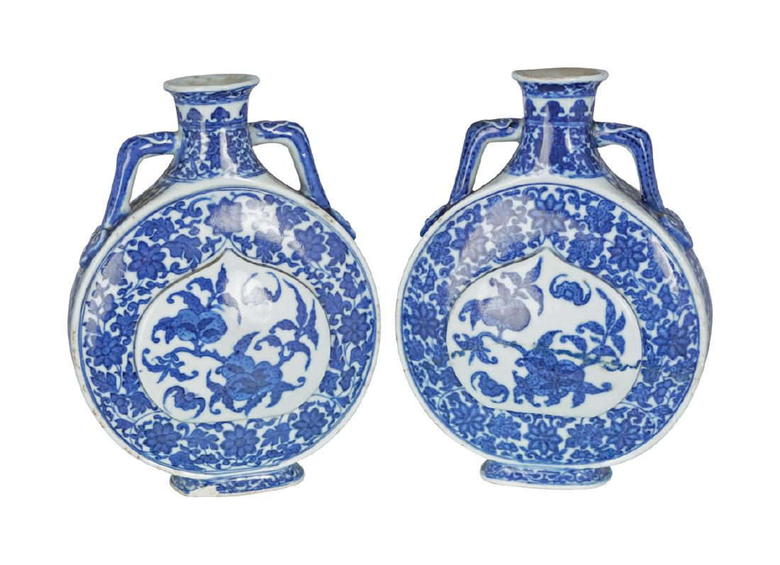 PAIR OF CHINESE QING PERIOD BLUE AND WHITE MOON FLASKS: PAIR OF CHINESE QING PERIOD BLUE AND WHITE MOON FLASKS Dimensions: Each 18 cm. high