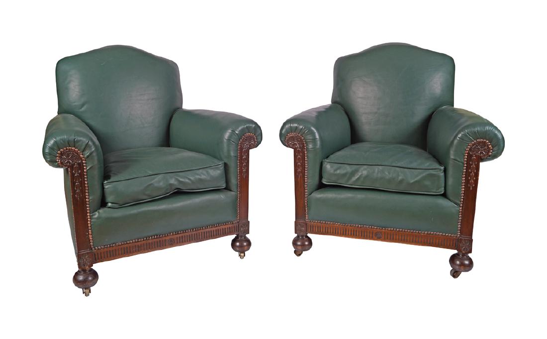 PAIR OF EDWARDIAN MAHOGANY AND LEATHER UPHOLSTERED CLUB: PAIR OF EDWARDIAN MAHOGANY AND LEATHER UPHOLSTERED CLUB ARM CHAIRS each raised on bun feet to the fore 97 cm. high; 86 cm. wide; 79 cm. deep