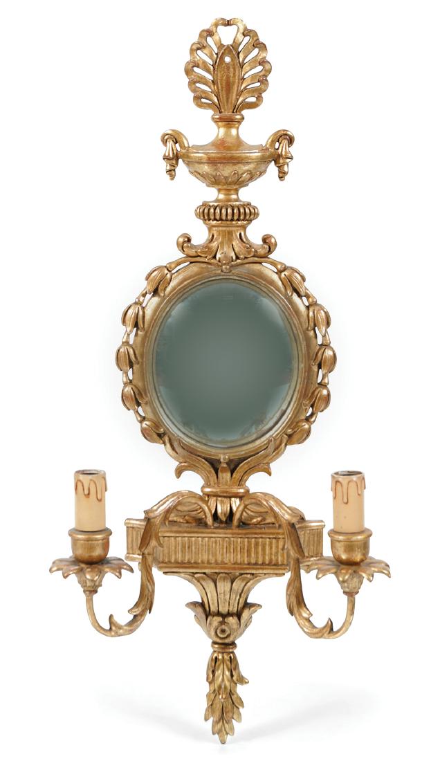 PAIR OF GILT WOOD WALL SCONCES: each with a convex mirror, within a bell petal decorated frame, fronted by scroll candle holders 78 cm. high; 30 cm. wide
