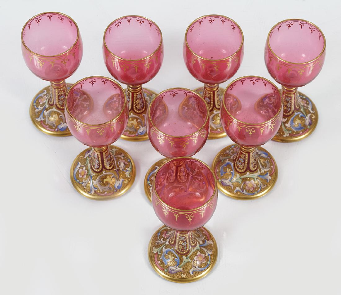 SET OF EIGHT 19TH-CENTURY BOHEMIAN WINE GLASSES: each with a circular globe on a tall stem and polychrome, parcel gilt circular foot 15 cm. high