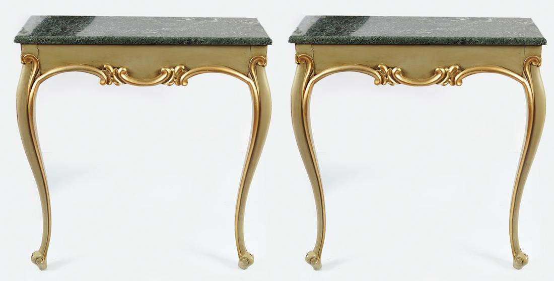PAIR OF 19TH-CENTURY CONSOLE TABLES: Pair of 19th-century painted and parcel gilt console tables, each with a rectangular marble top, above a conforming frieze, with a serpentine leaf scroll carved apron, raised on cabriole legs, 77 cm.