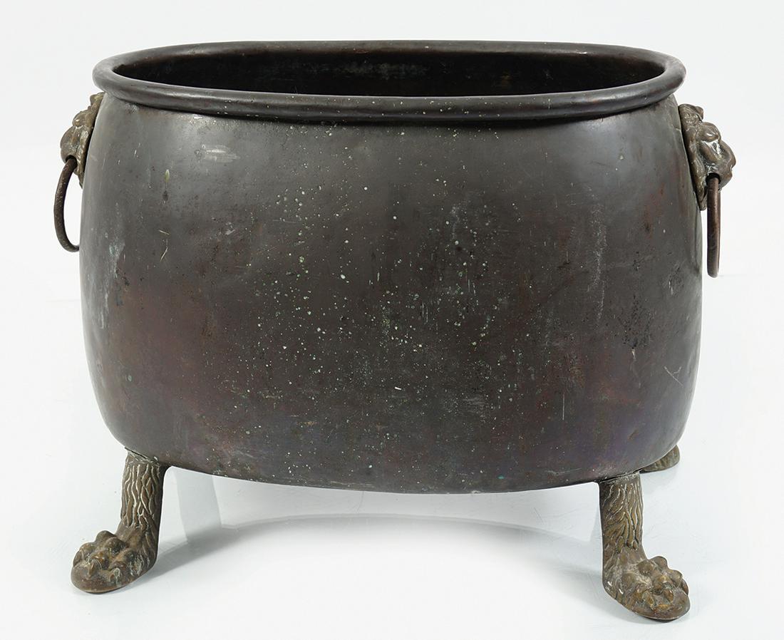 LARGE GEORGIAN COPPER LOG BOX: of oval bulbous form, raised on brass claw feet 42 cm. high; 58 cm. wide; 35 cm. deep