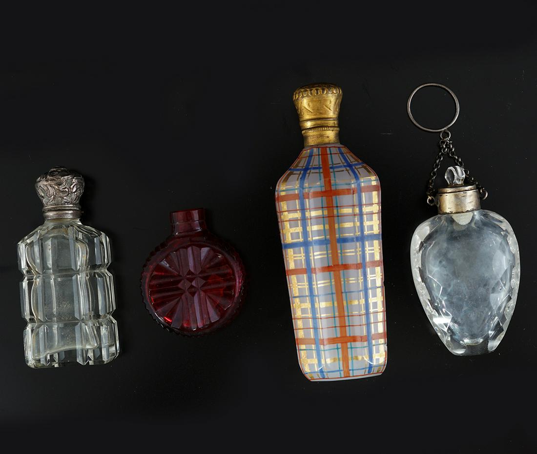 GROUP OF FOUR 19TH-CENTURY GLASS PERFUME BOTTLES: with various silver and gilded stoppers