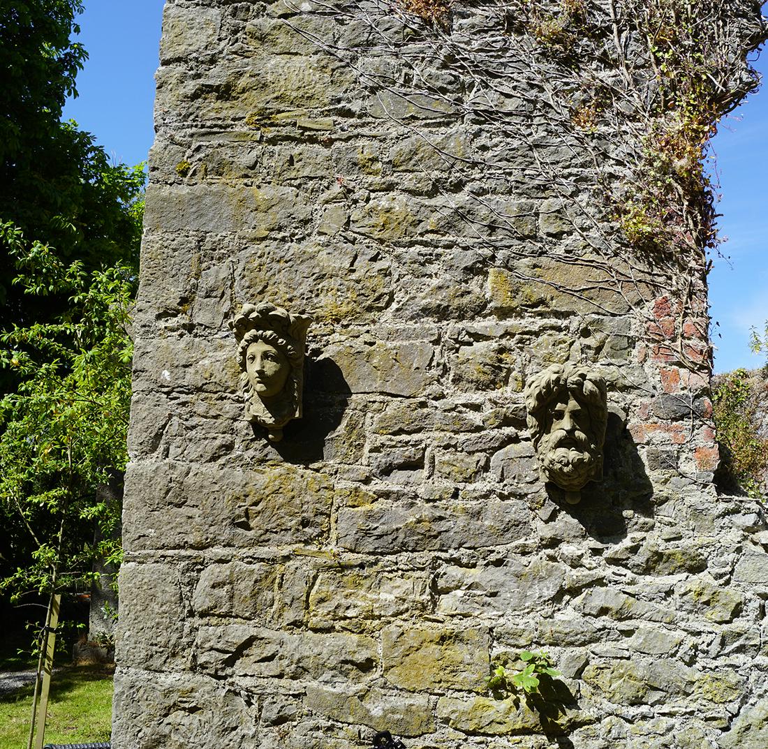 PAIR OF MOULDED STONE MASK FLOWER POCKETS (1 of 6)