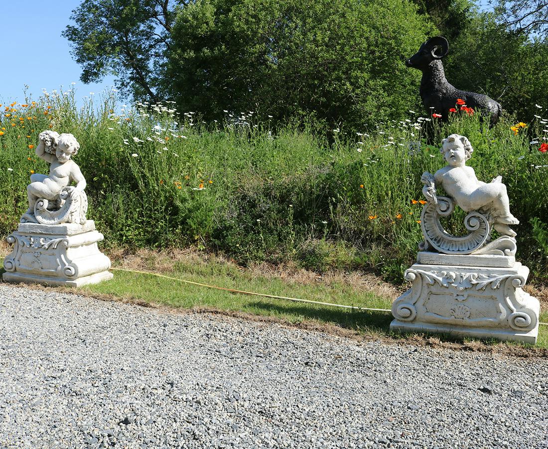 PAIR OF ITALIANATE PUTTI (1 of 3)