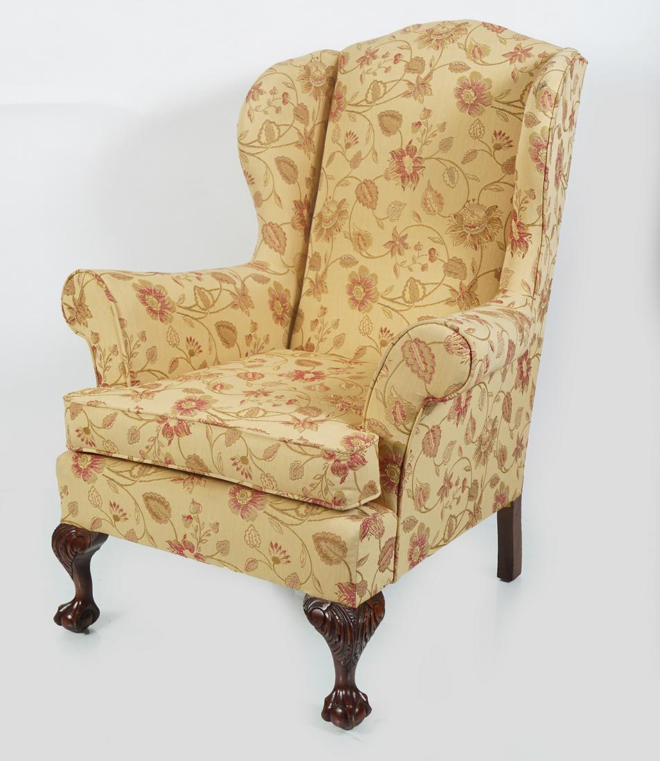PAIR OF GEORGE III STYLE WINGBACK ARMCHAIRS: each with an upholstered back and seat raised on cabriole legs to the fore terminating on claw and ball feet. 107 cm. high; 84 cm. wide; 76 cm. deep
