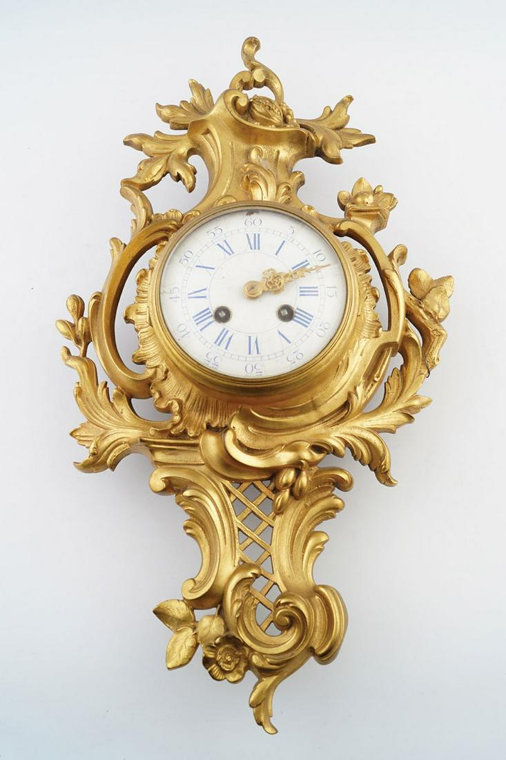 19TH-CENTURY ORMOLU CASED CARTEL CLOCK: the enamelled dial with blue Roman numerals, the works stamped Japy Freres, Paris 53 cm. high; 27 cm. wide