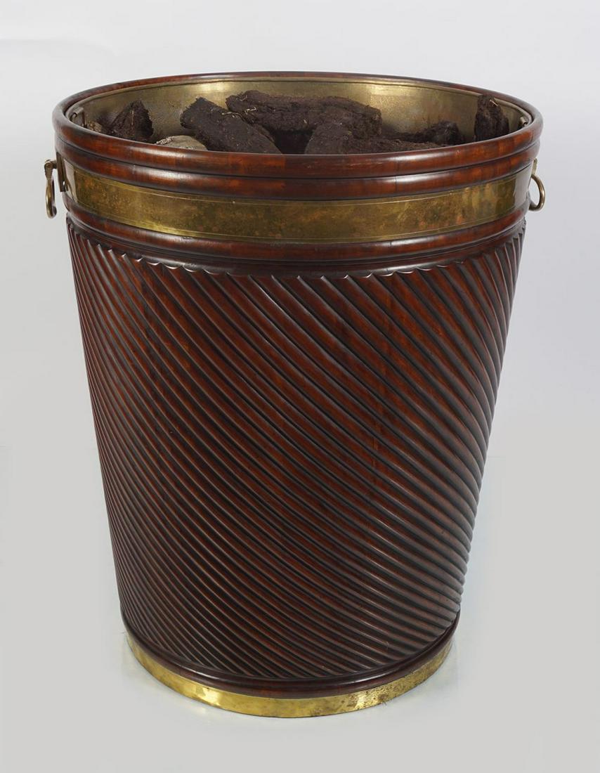 ENORMOUS GEORGE III STYLE BRASS BOUND PEAT BARREL: of spiral turned form furnished with brass lug handles. 92 cm high; 75 cm. diameter