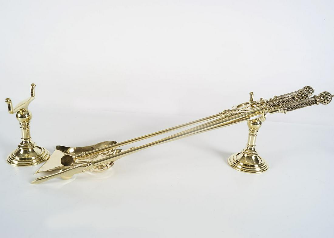 SET OF 19TH-CENTURY BRASS FIRE IRONS: and dogs each with a filigree pierced handle.