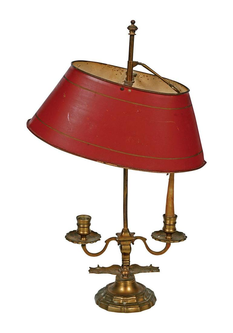 EDWARDIAN BRASS TABLE LAMP: with toleware shade and two scroll arms 40 cm. high